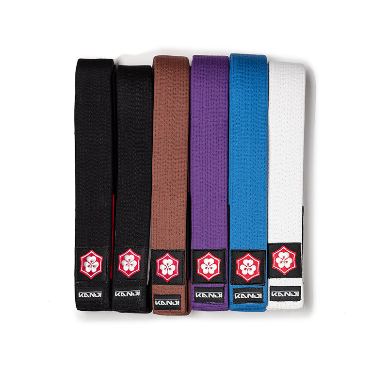 Original KANJI belts in black, brown, purple, blue, and white, photographed together on a white background