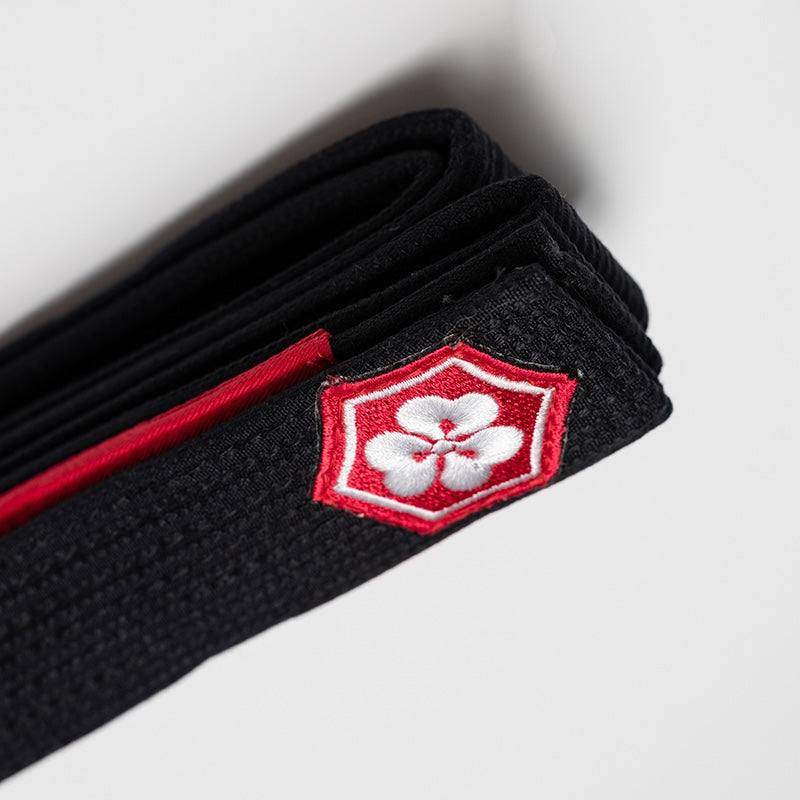 Close-up of Kanjibrand belt stitching and red flower mark
